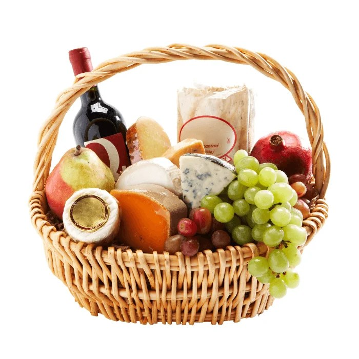 A wicker basket filled with fruits and a bottle of wine
