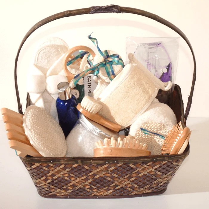 A wicker basket filled with bath items including brushes and towels