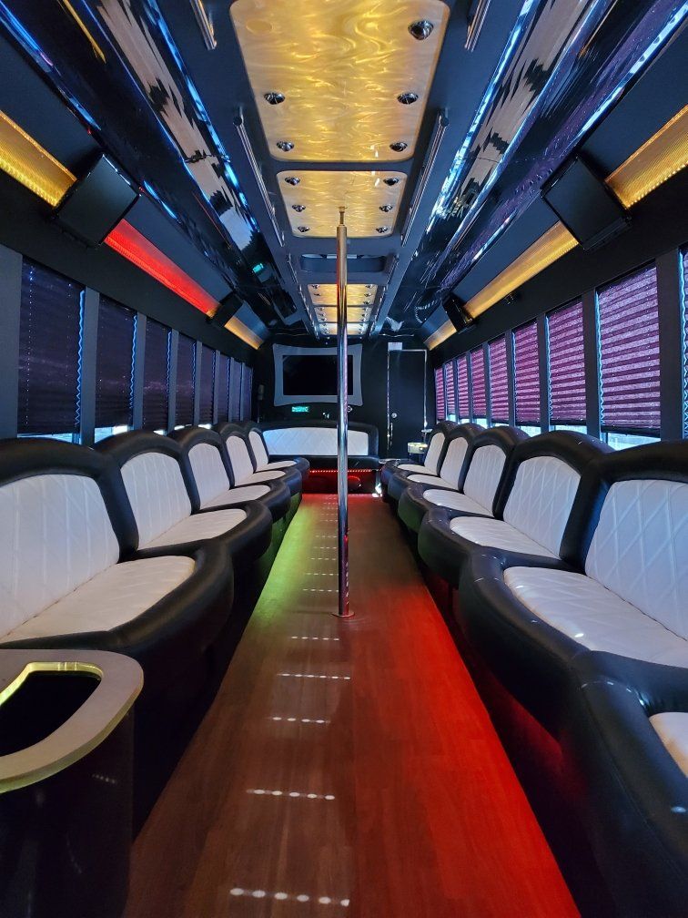 The inside of a bus with a lot of seats and tables