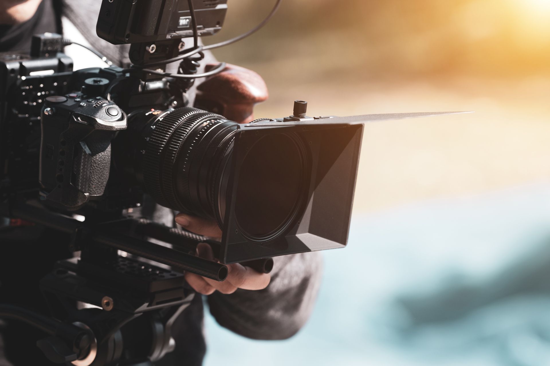A person is holding a video camera in their hand.
