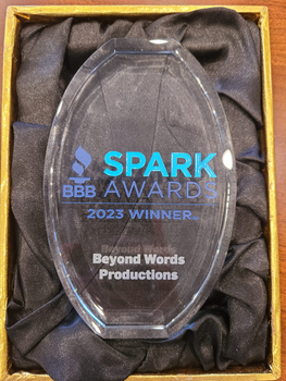 SPARK Awards 2023 winner plaque for Beyond Words Productions in a black satin-lined box