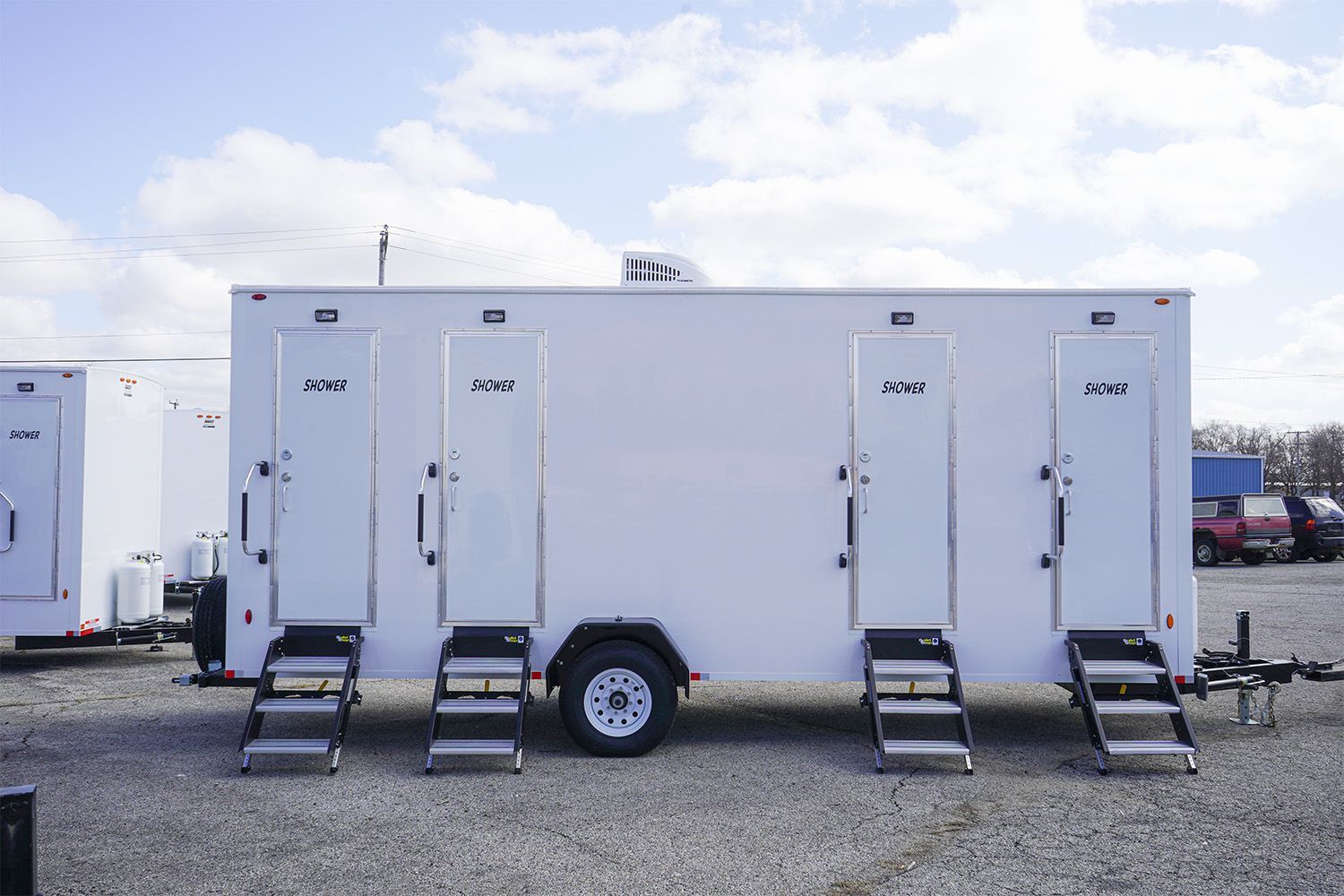 4 station restroom shower trailer side view Downey CA Affordable Porta Potty