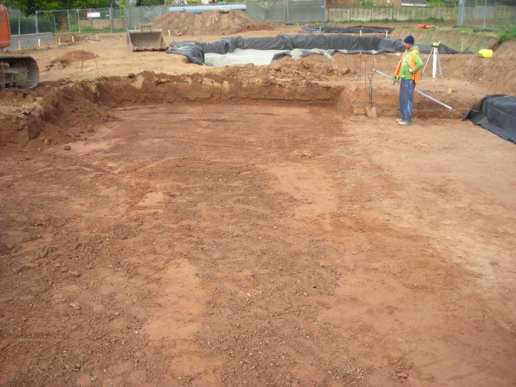 The site is marked out and soil stripped to the formation level.  The actual depth will depend on the local site conditions.