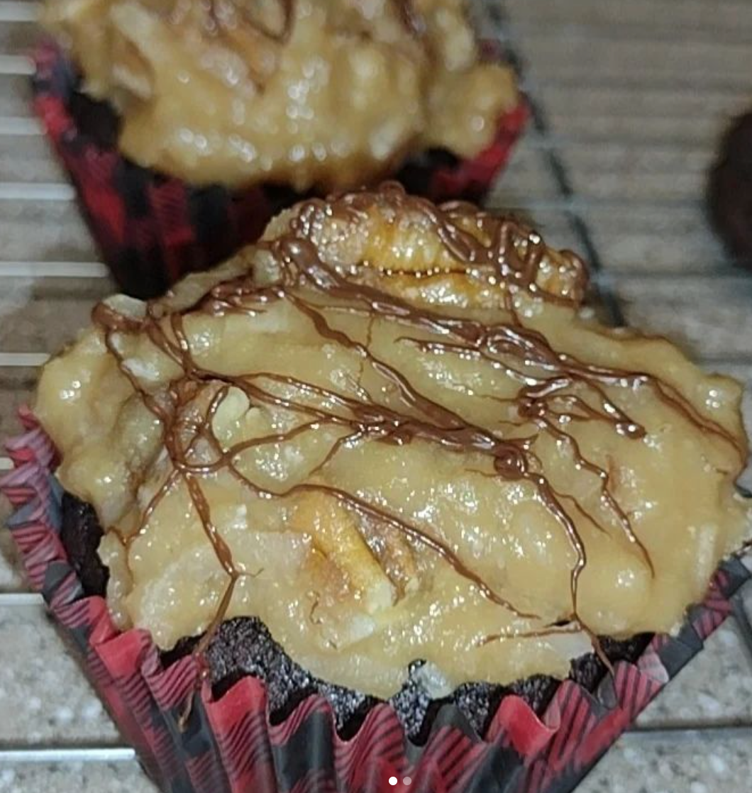 A close up of a cupcake on a cooling rack