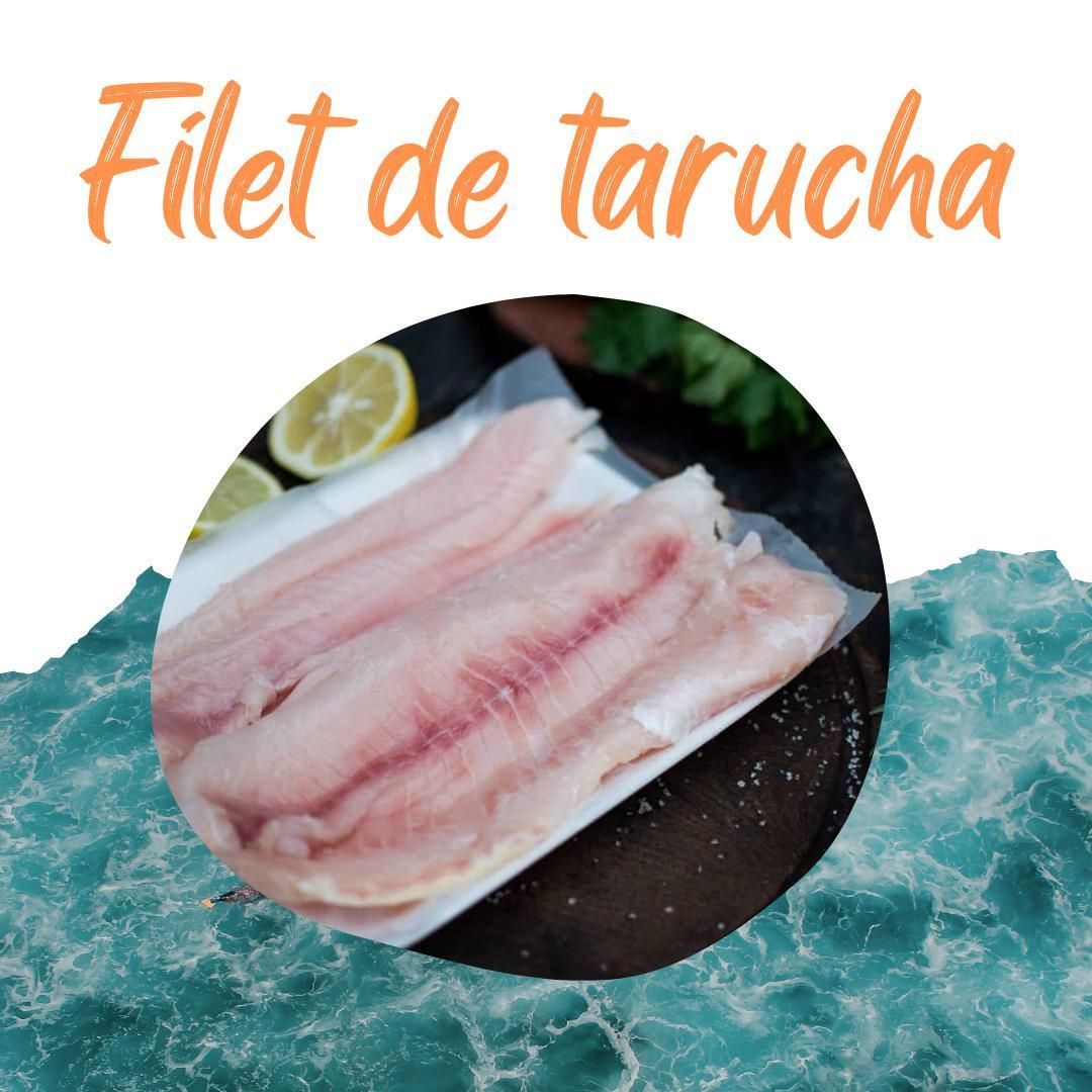 Una foto de filete de tarucha con limones al fondo.