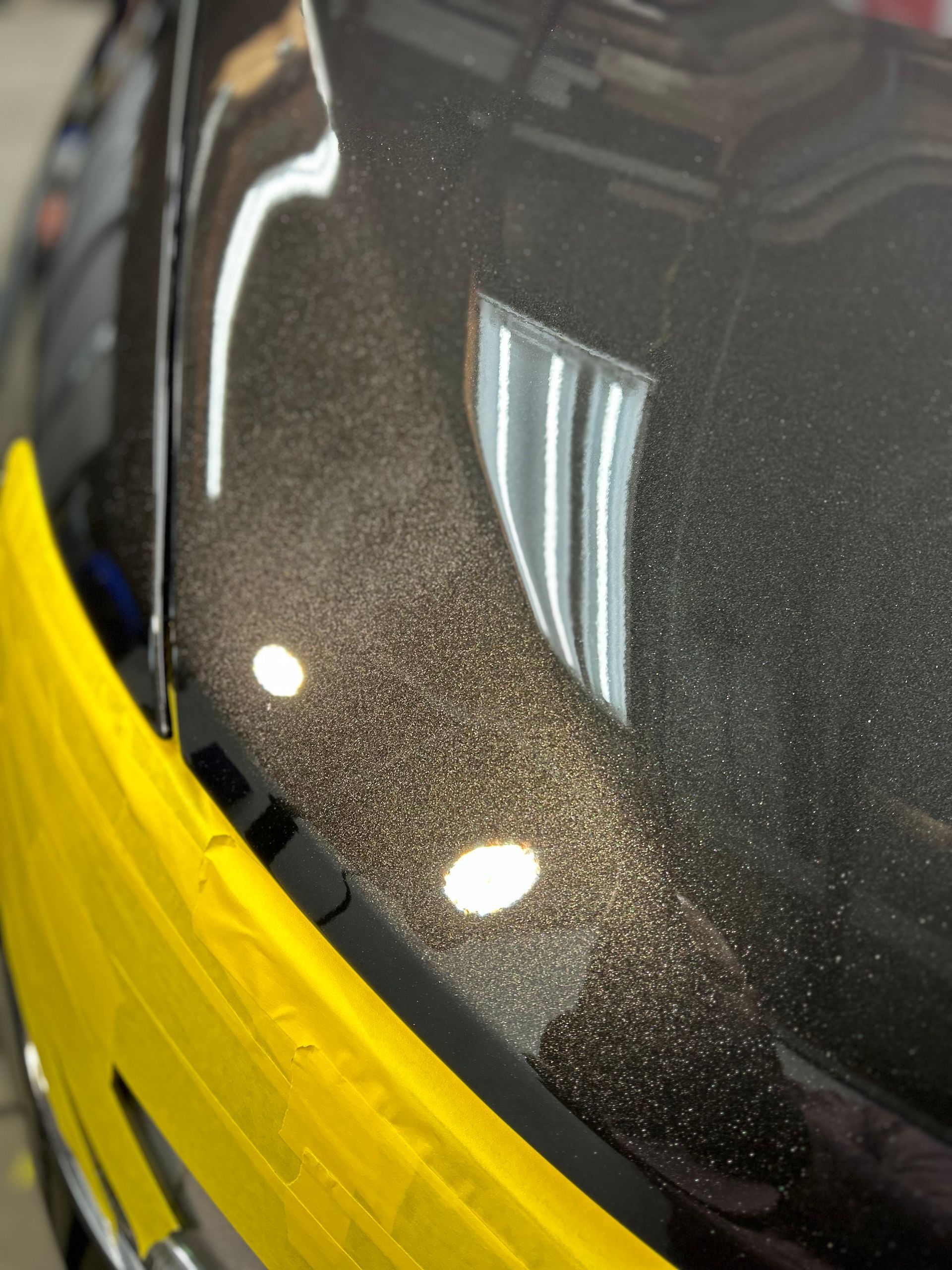 a blue pickup truck is parked on the side of the road .