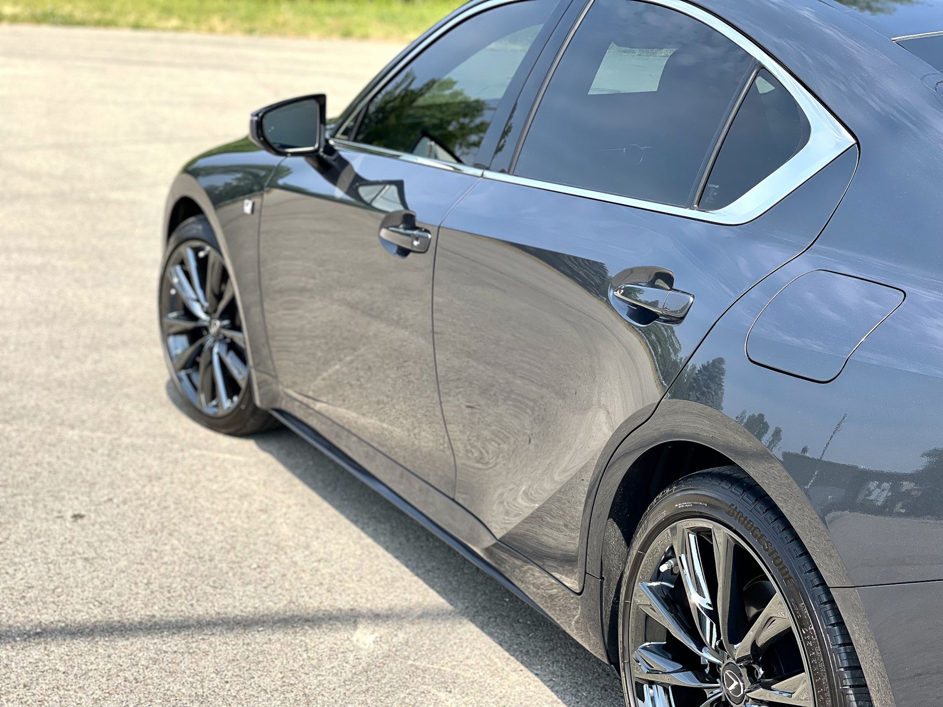 a red ford bronco is parked in front of a house .