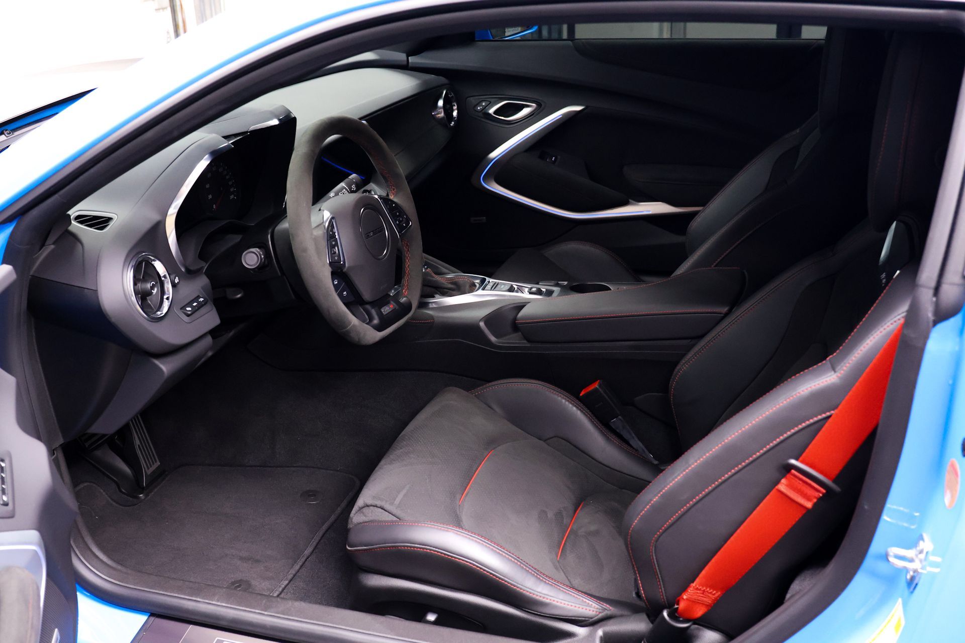 the interior of a red ford expedition with brown leather seats