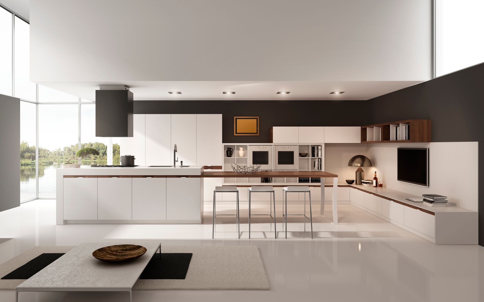 Cucina beige con parete nera, elettrodomestici in acciaio inossidabile e isola in legno.