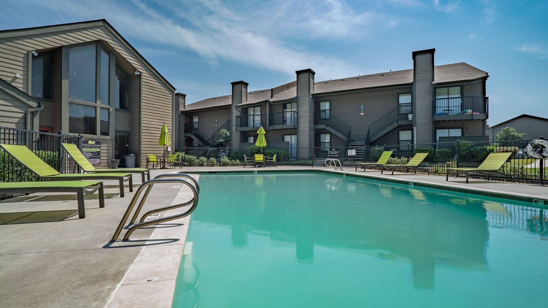 A living room filled with furniture and a ceiling fan.