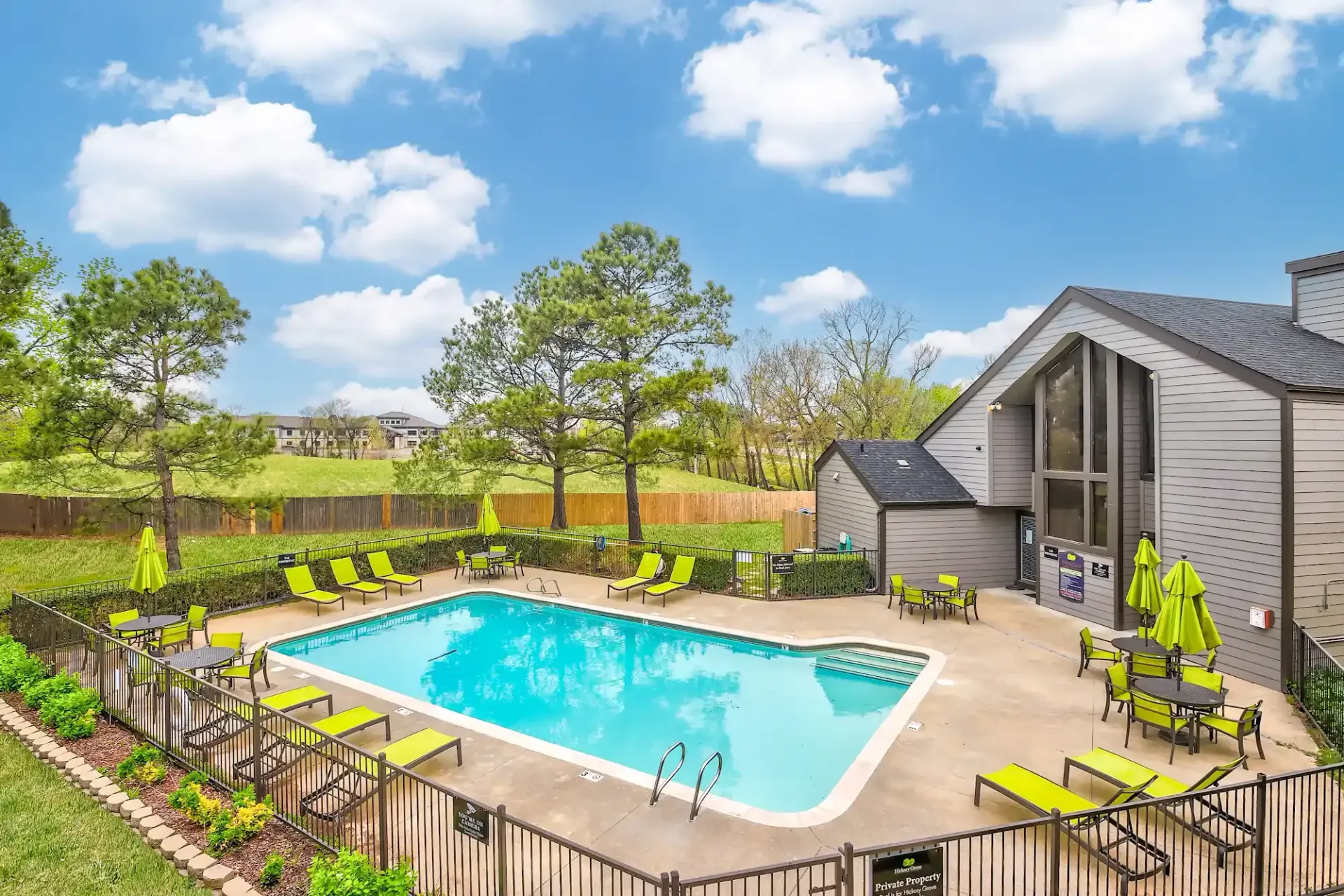 A large house with a lot of windows and a walkway leading to it.