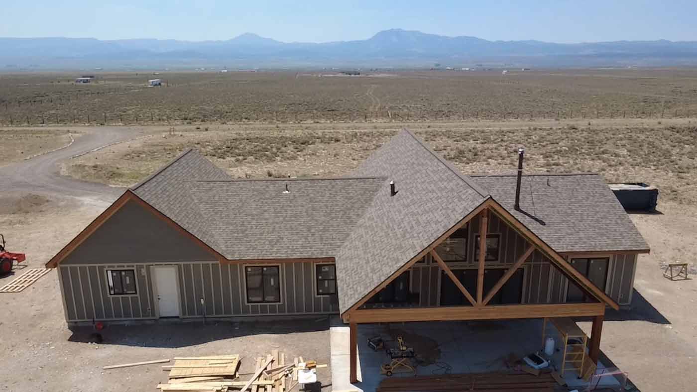An aerial view of a house under construction in the desert