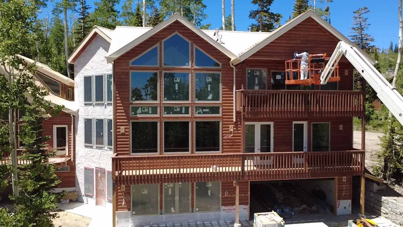 A large house with a lot of windows is being built