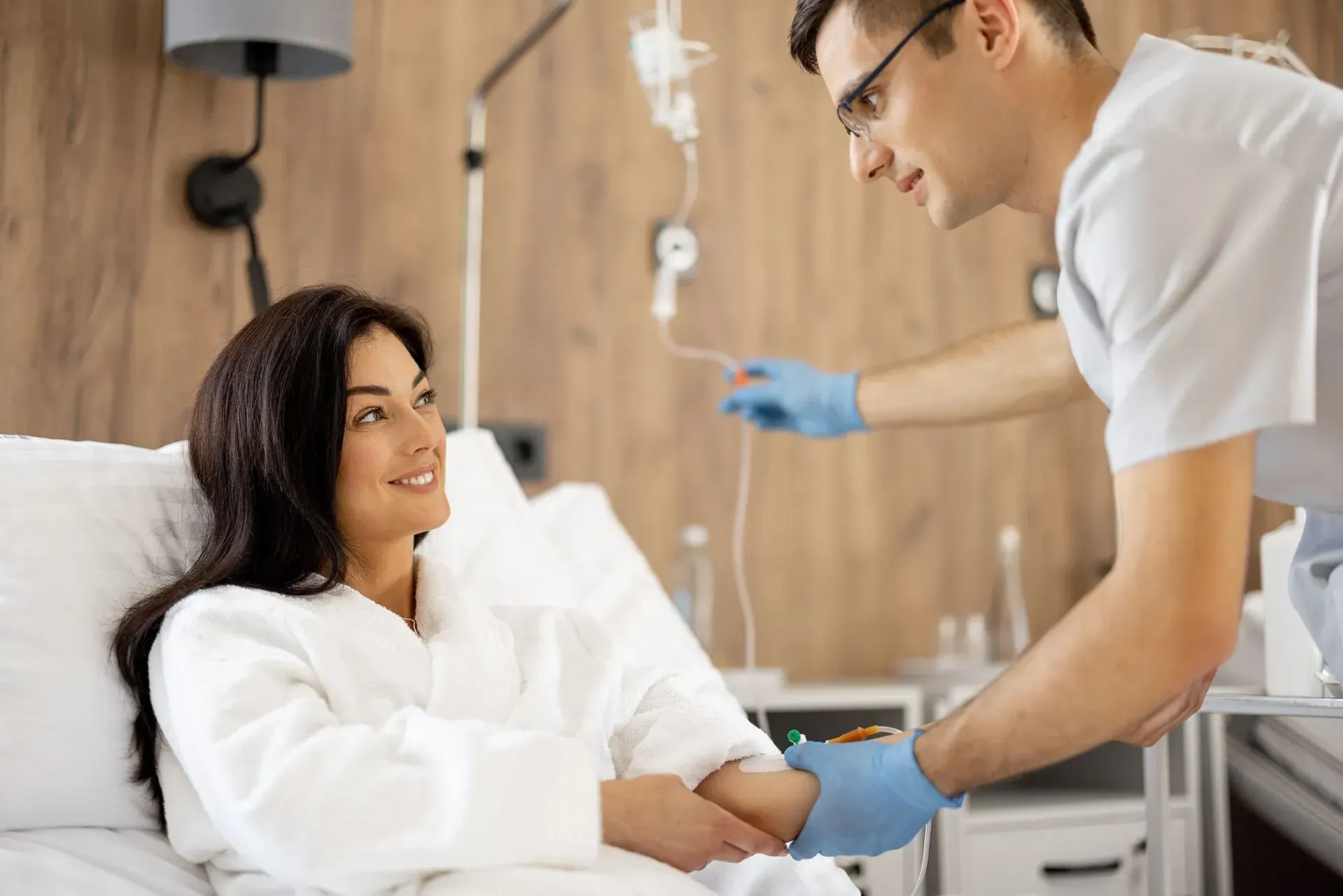 Nurse preparing IV hydration for a patient