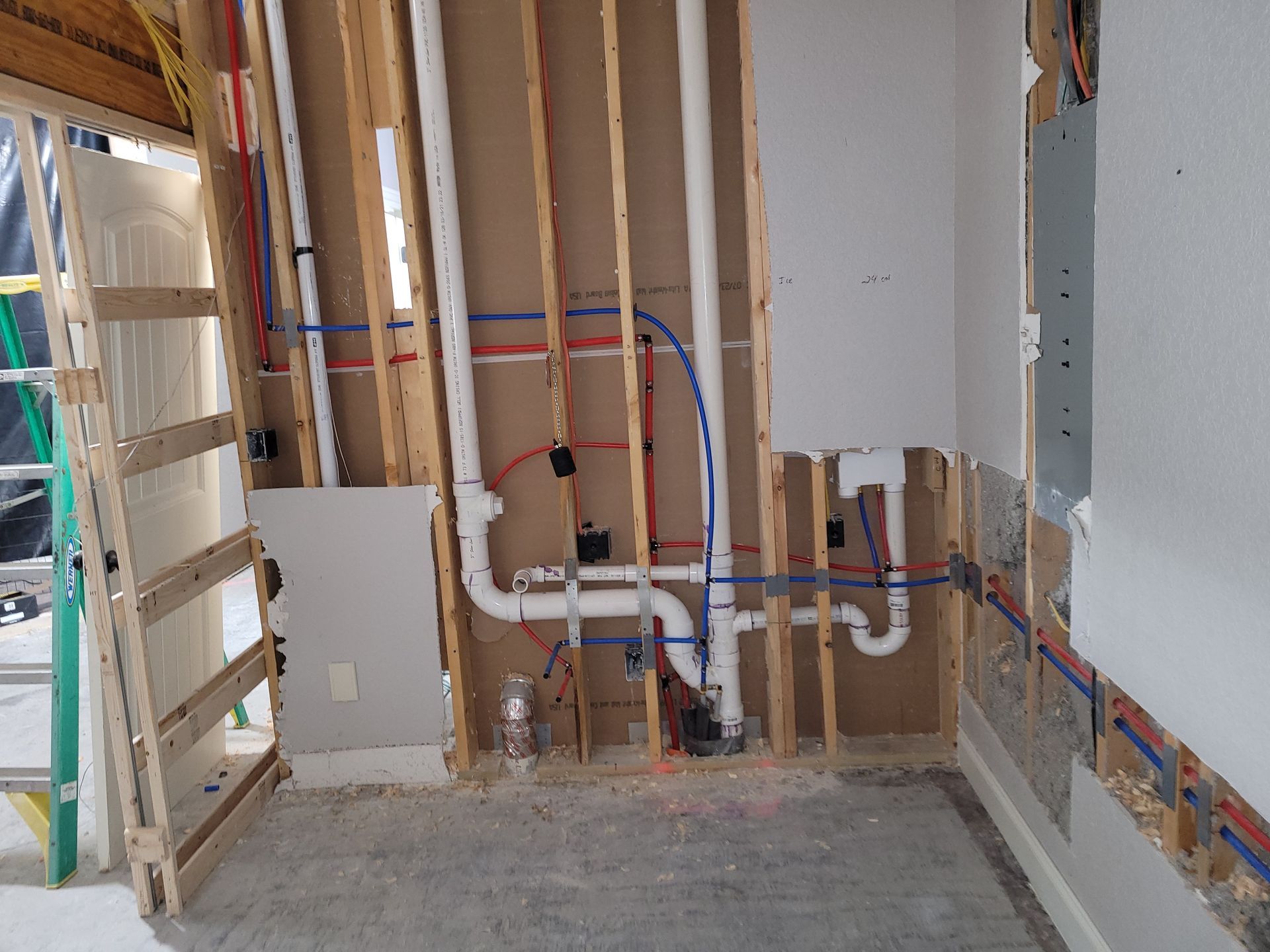 A room with a lot of pipes coming out of the wall.