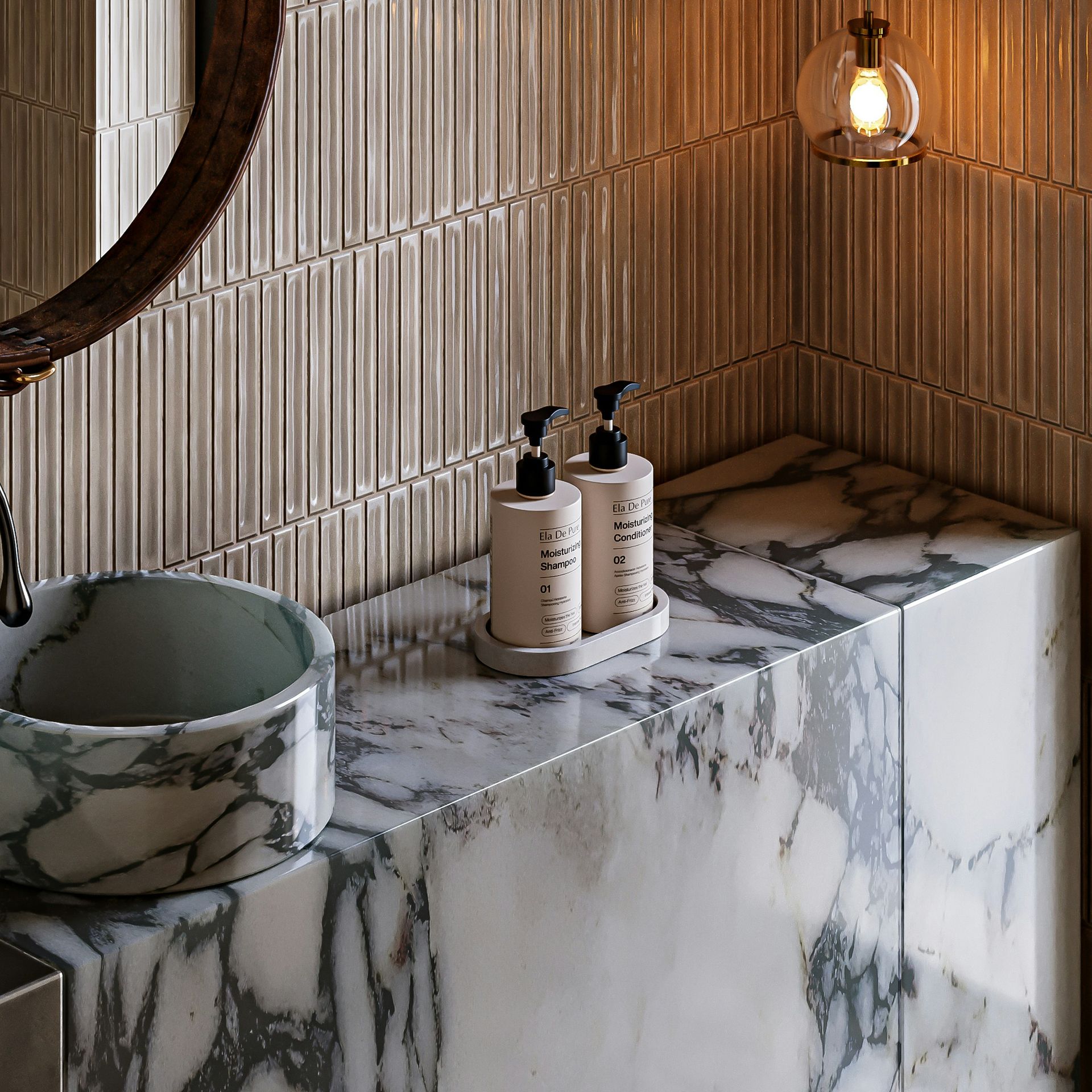 A close-up of a custom built marble sinktop with vessel sink and two bottles of handsoap. There is a rectangular tile surround and soft warm lighting.