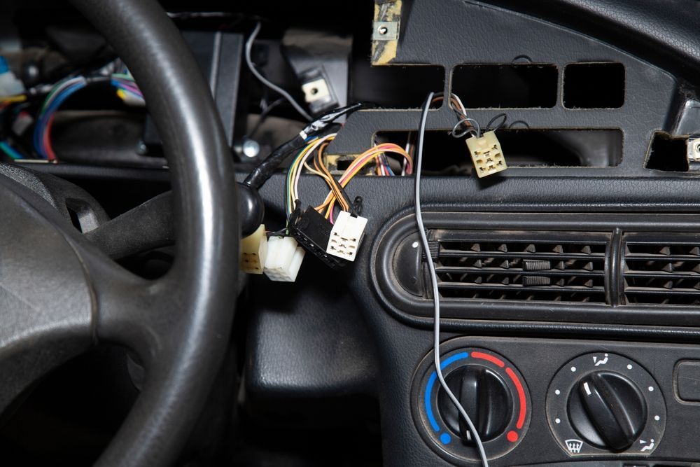 Car Dashboard Interior With Exposed Wiring — Pete's Auto Electrical in Cranbourne, VIC