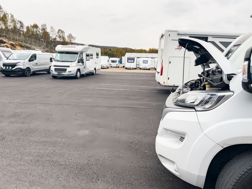 Campers Parked on Asphalt, One With Hood Open — Pete's Auto Electrical in Cranbourne, VIC