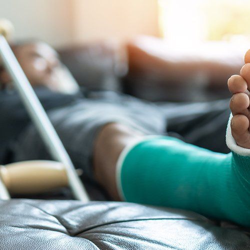 Man With Splint Cast and Crutches at Home — Plainville, CT — Mastrianni & Seguljic LLC