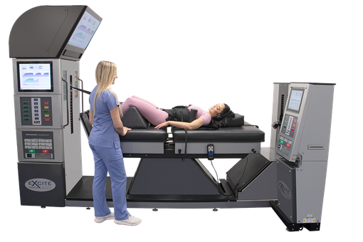 A person in scrubs assists a patient lying on a spinal decompression therapy table in a medical setting.