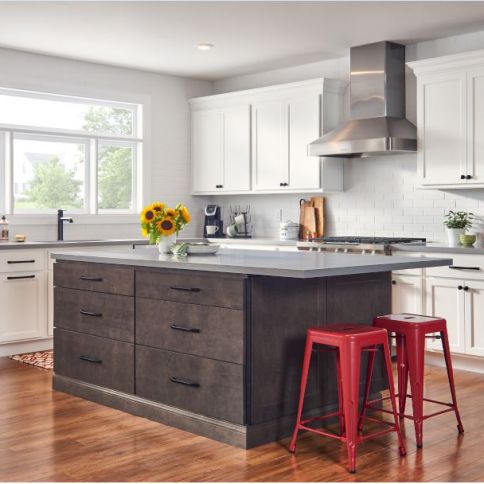 Modern kitchen with white upper cabinets and a dark wood island with red stools.