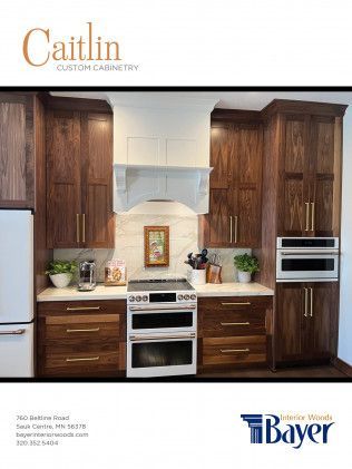 Kitchen with dark wood cabinets, white range hood, and gold hardware.