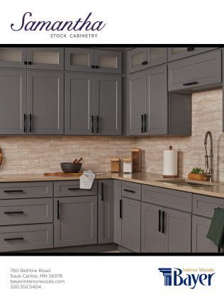 Gray kitchen cabinets in a modern kitchen with black hardware, beige backsplash, and a sink.