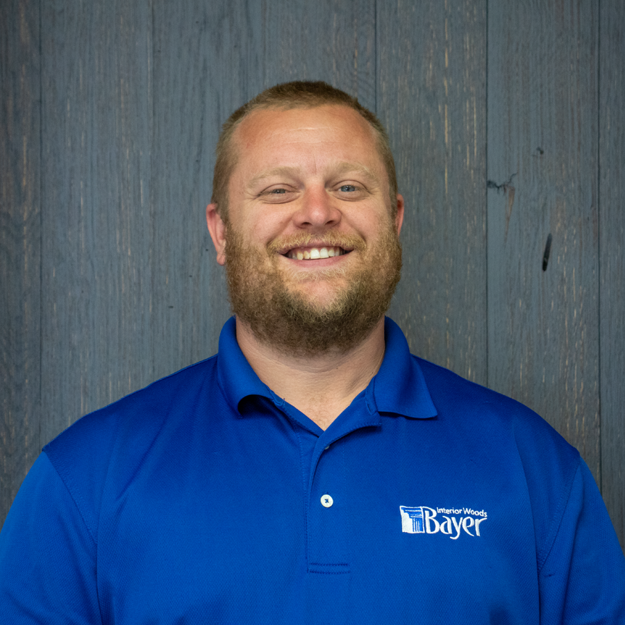 Silhouette of a person, head and shoulders, on a grey background.