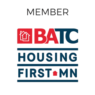 Logo of BATC Housing First MN. Red and blue with house symbols and text.