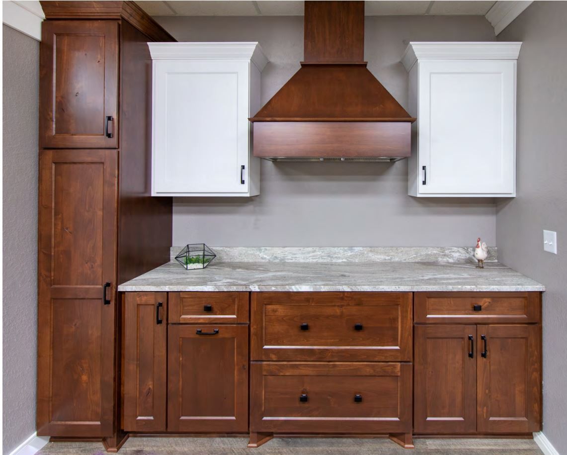 Kitchen cabinets: Dark brown and white, with a matching range hood. Gray countertop.