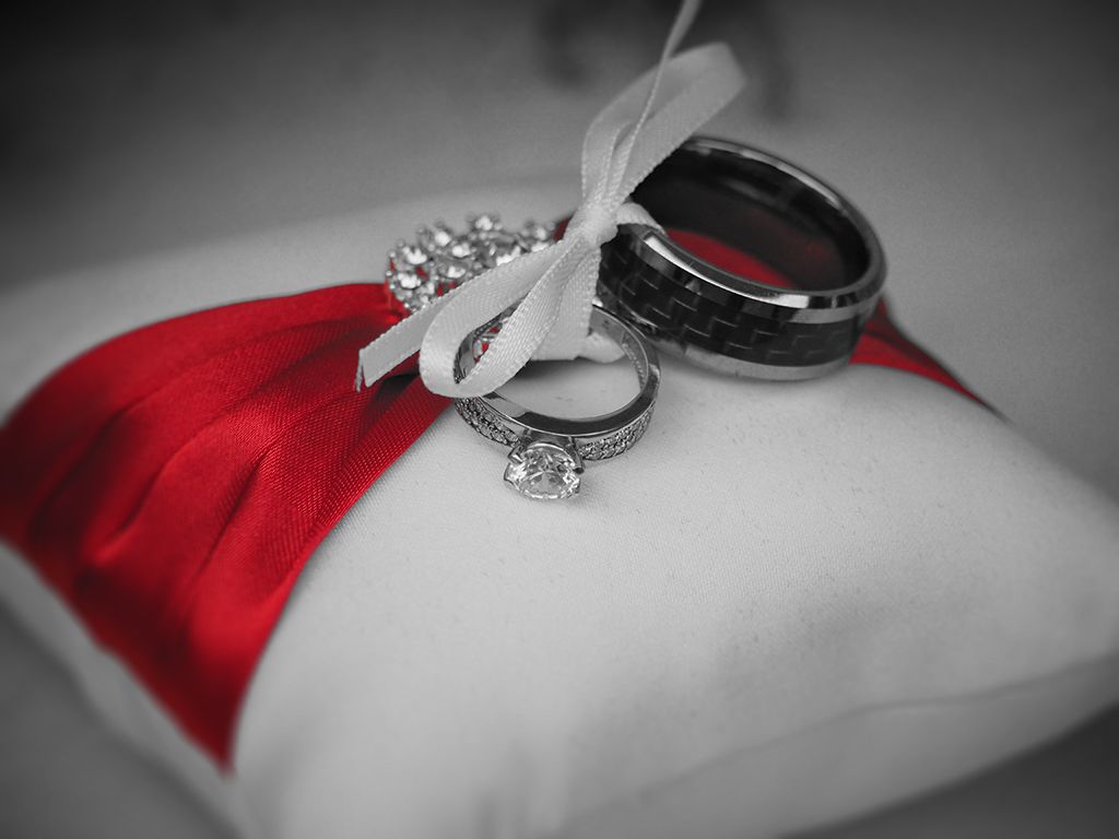 The wedding rings, photography of beautifully presented on a silk cushion at Bournemouth.