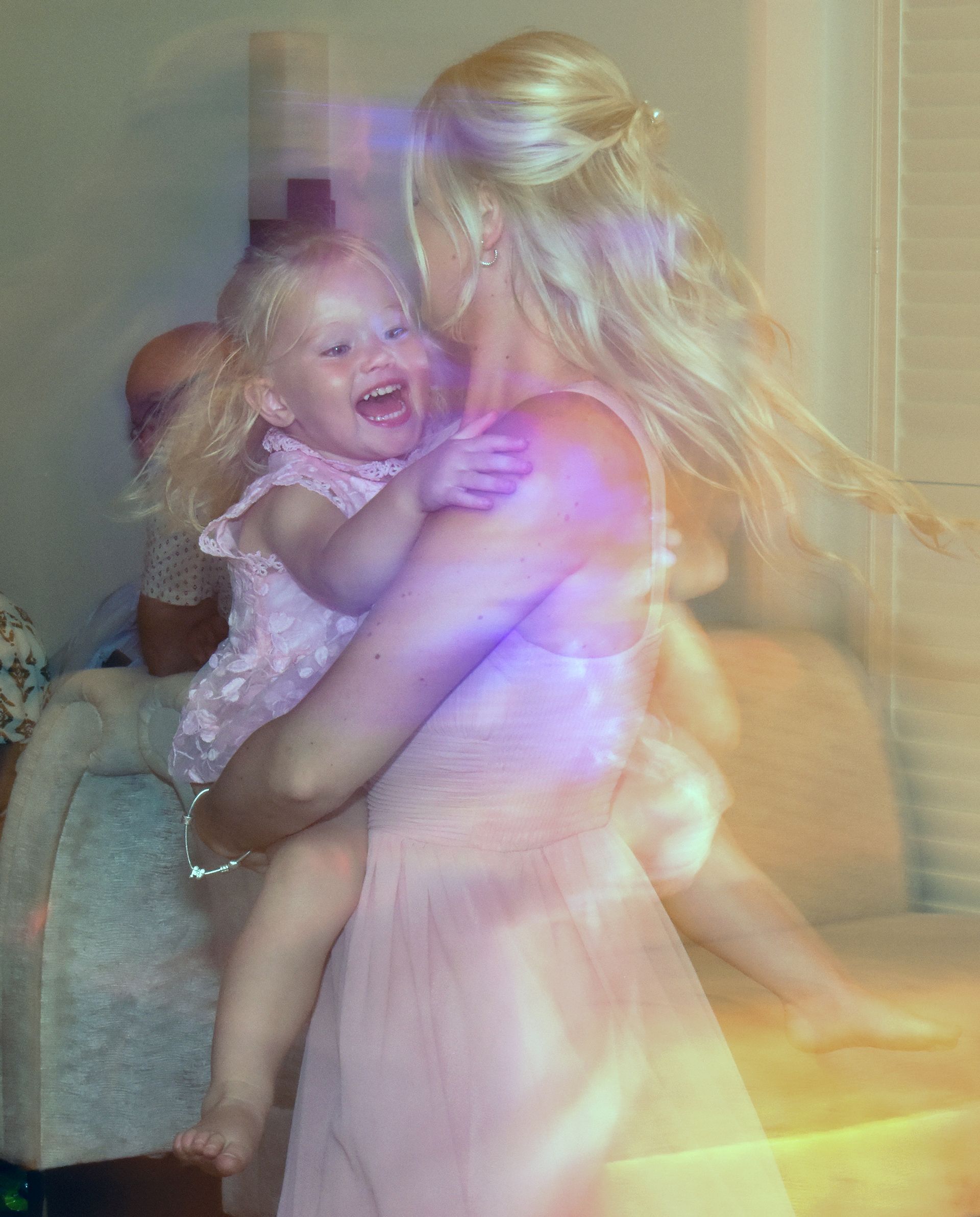 Photography of bridesmaid and daughter dancing at wedding in Christchurch.