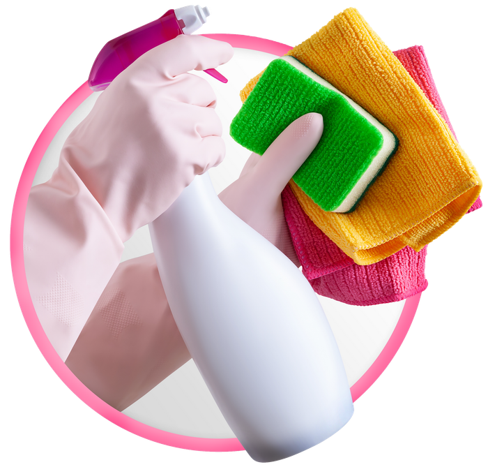 A person wearing pink gloves is holding a spray bottle and a sponge