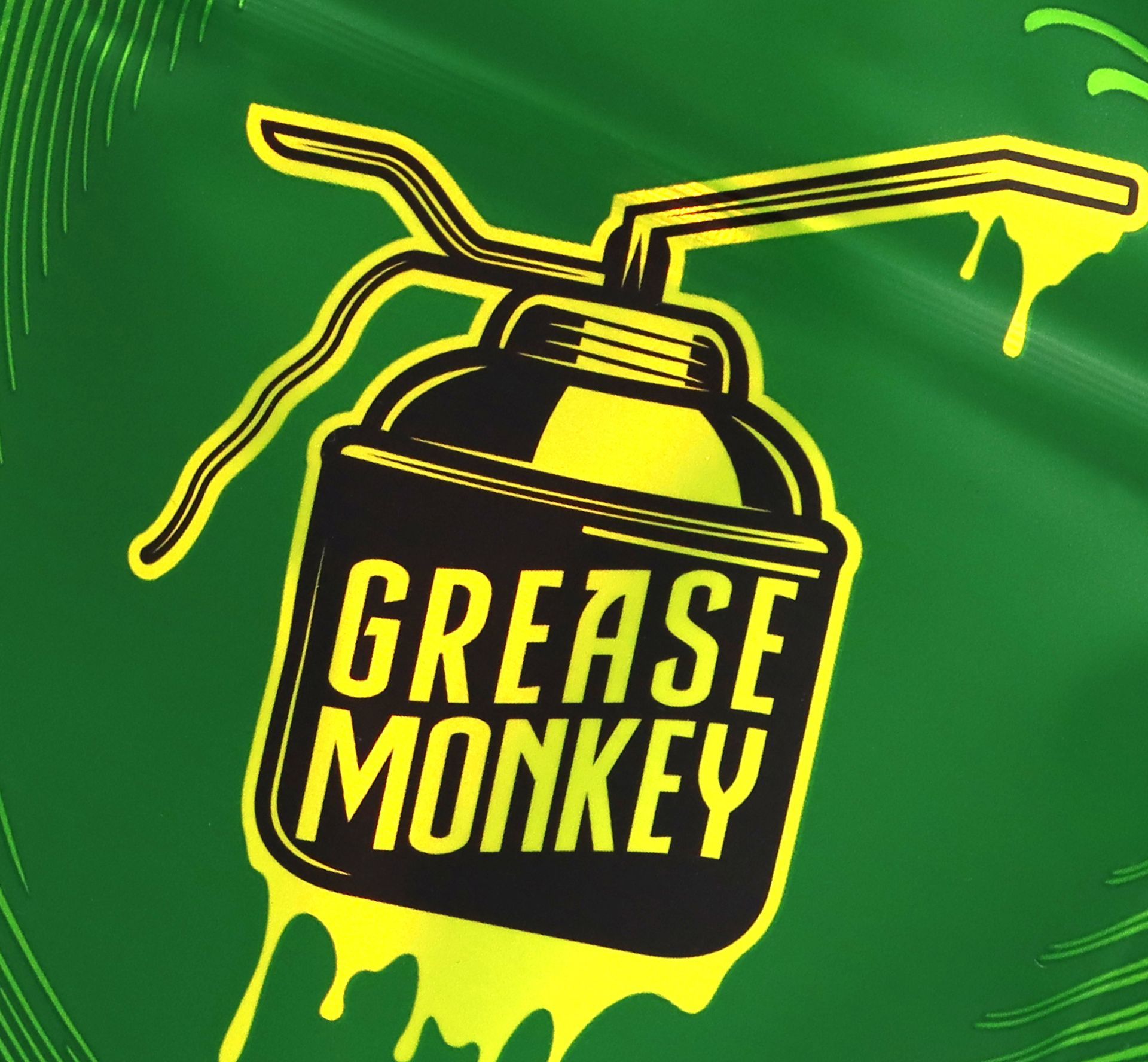 closeup of grease monkey packaging logo