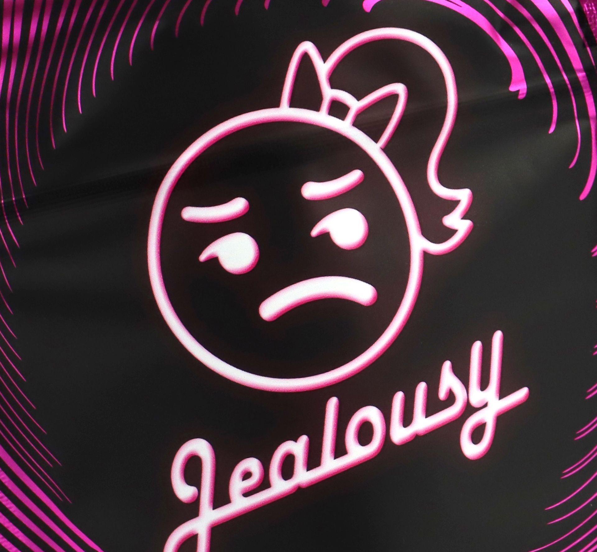 close up of jealousy packaging logo