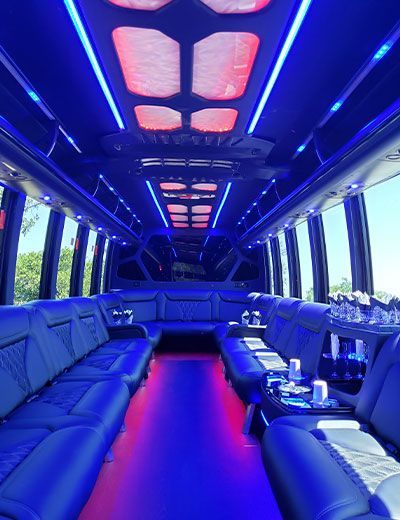 The inside of a limousine with blue and red lights