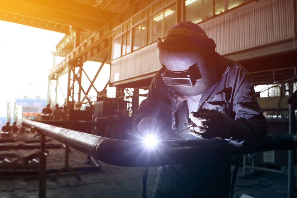 a man welding a metal