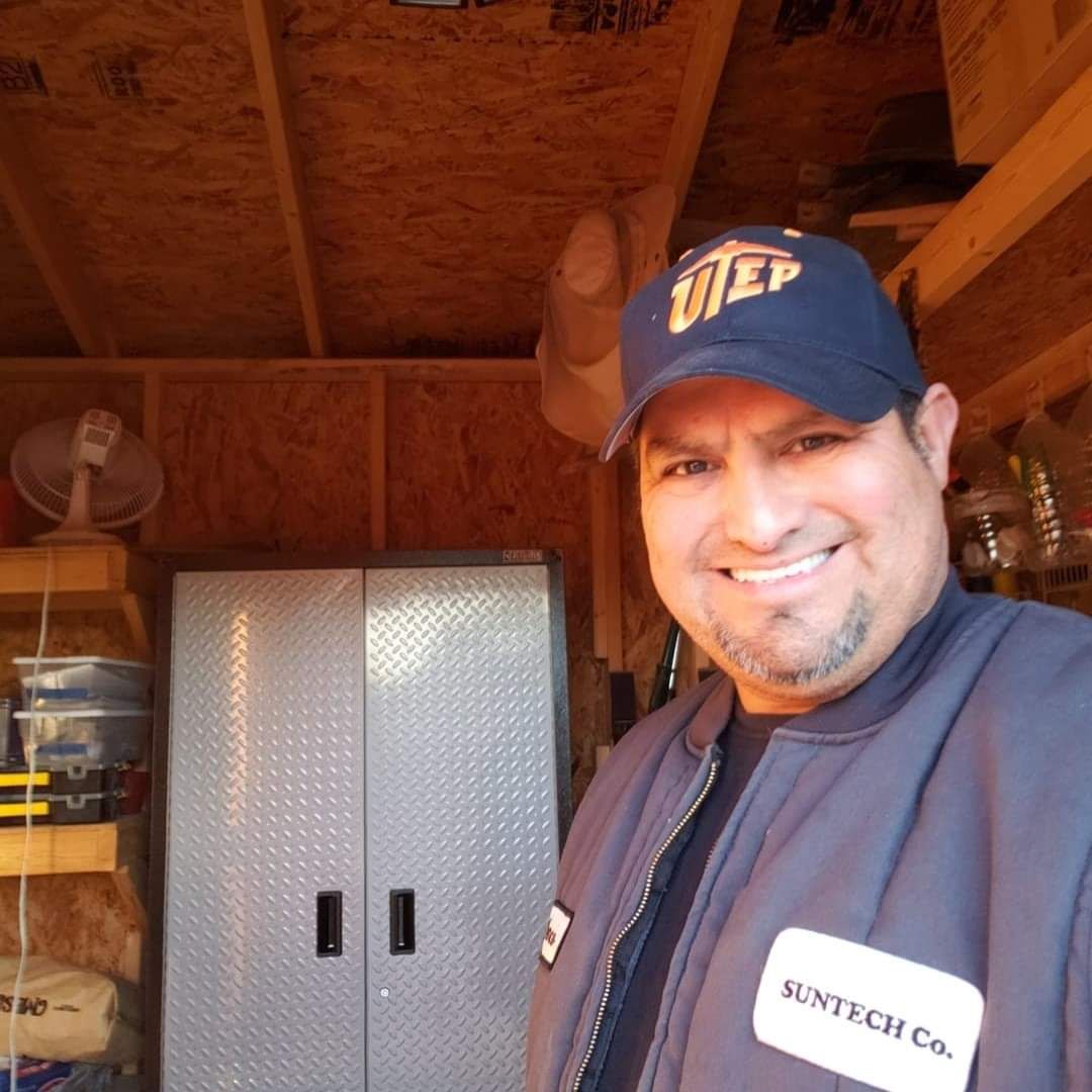 A bathroom with a walk in tub with a door.