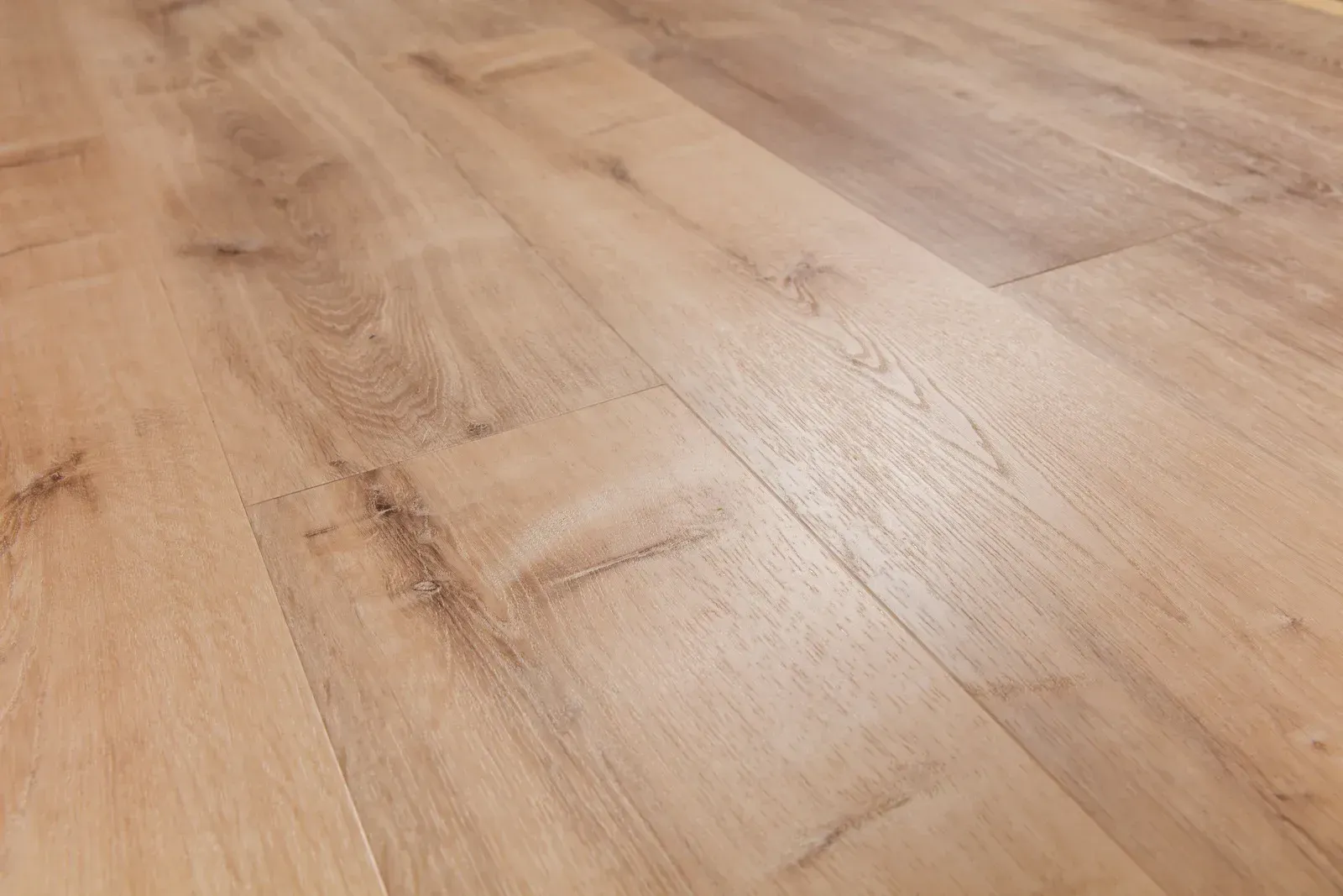 A close up of a wooden floor in a room.
