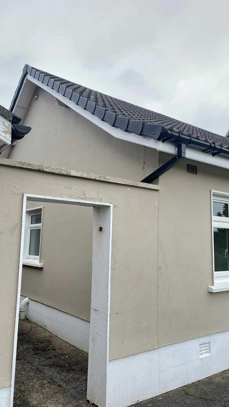 A small house with a roof and a doorway.