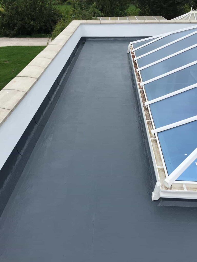 A roof with a blue skylight on top of it.