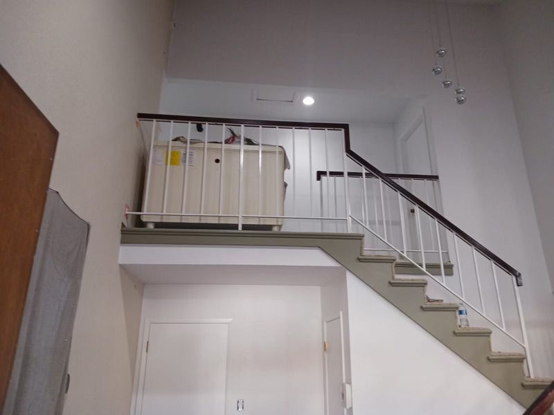 Staircase with a washer and dryer on the second floor — San Jose, CA — DB Remodeling