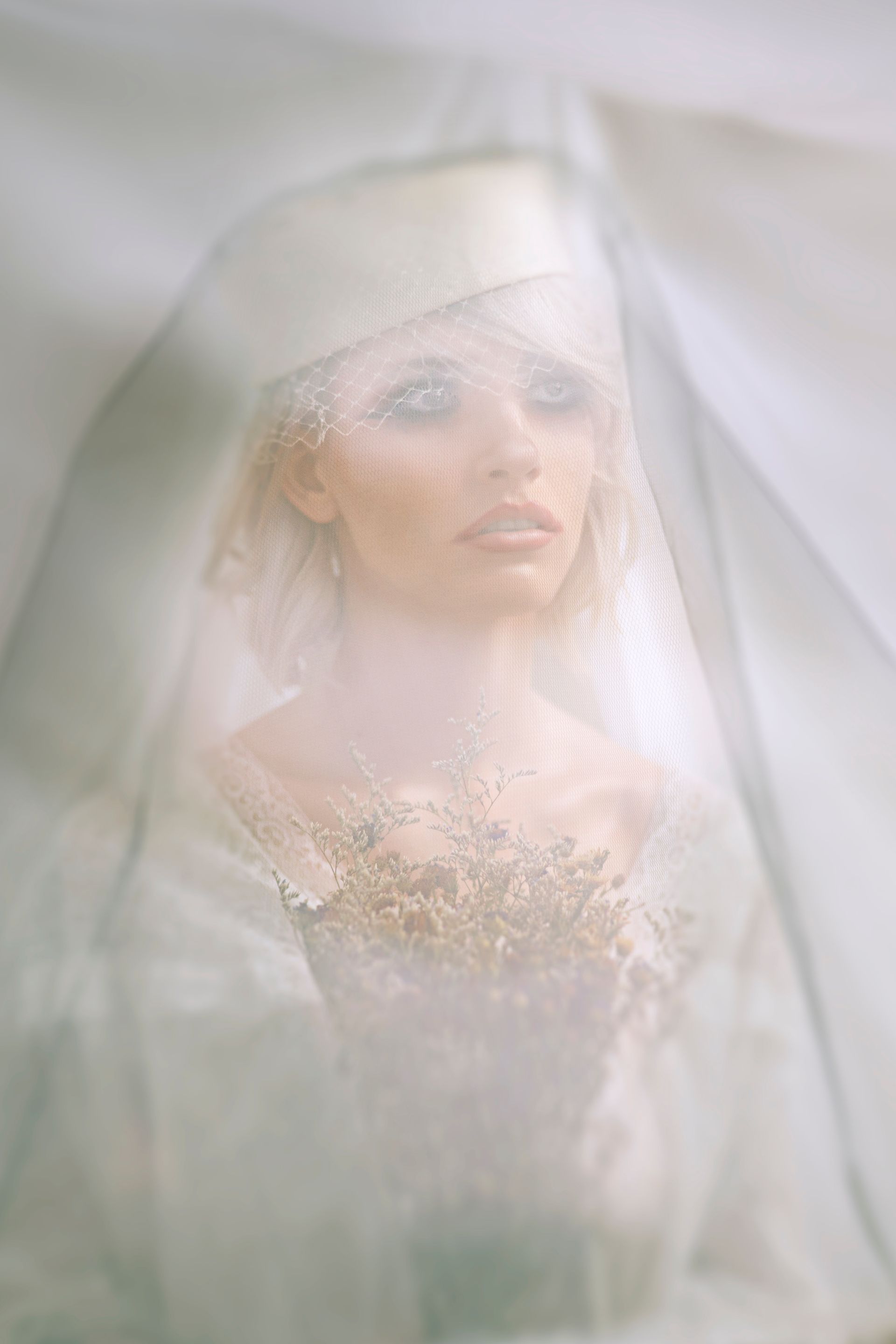 bride almost silhouette heavy makeup but faded