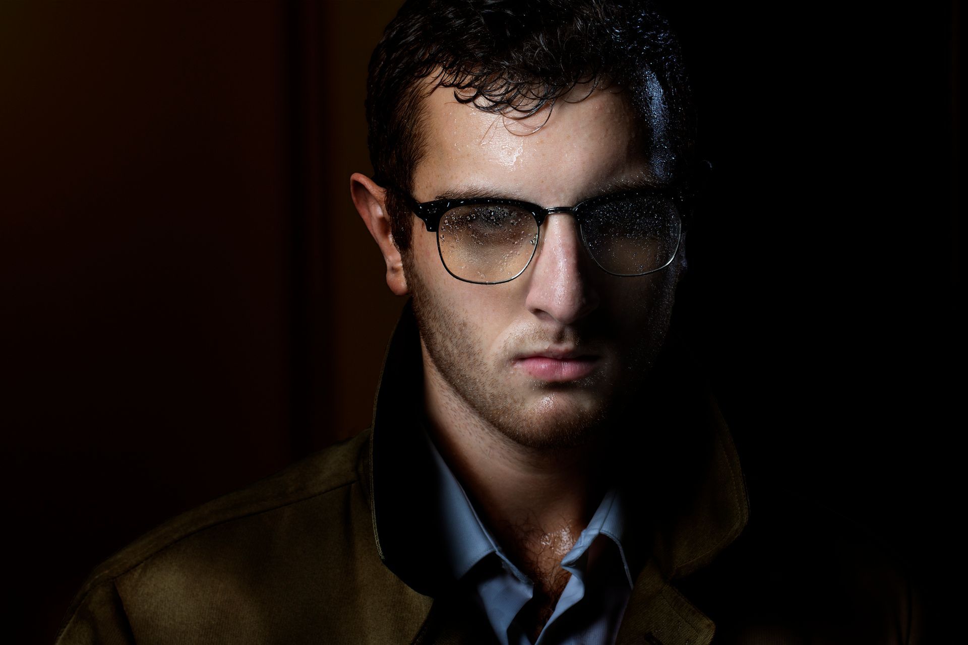 award winning photo of a man wet from rain