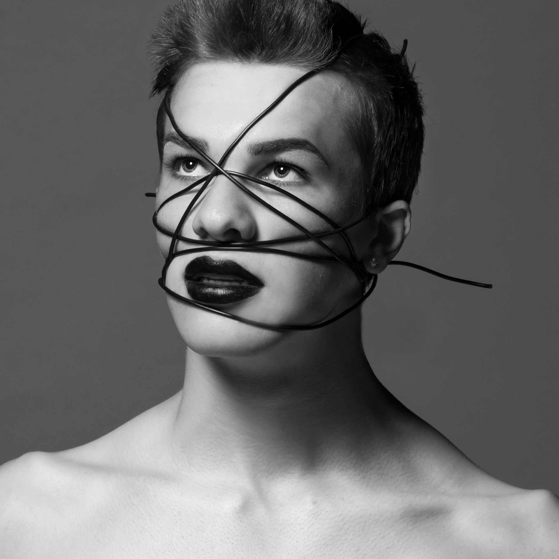 artistic photography with male model wrapped in wire