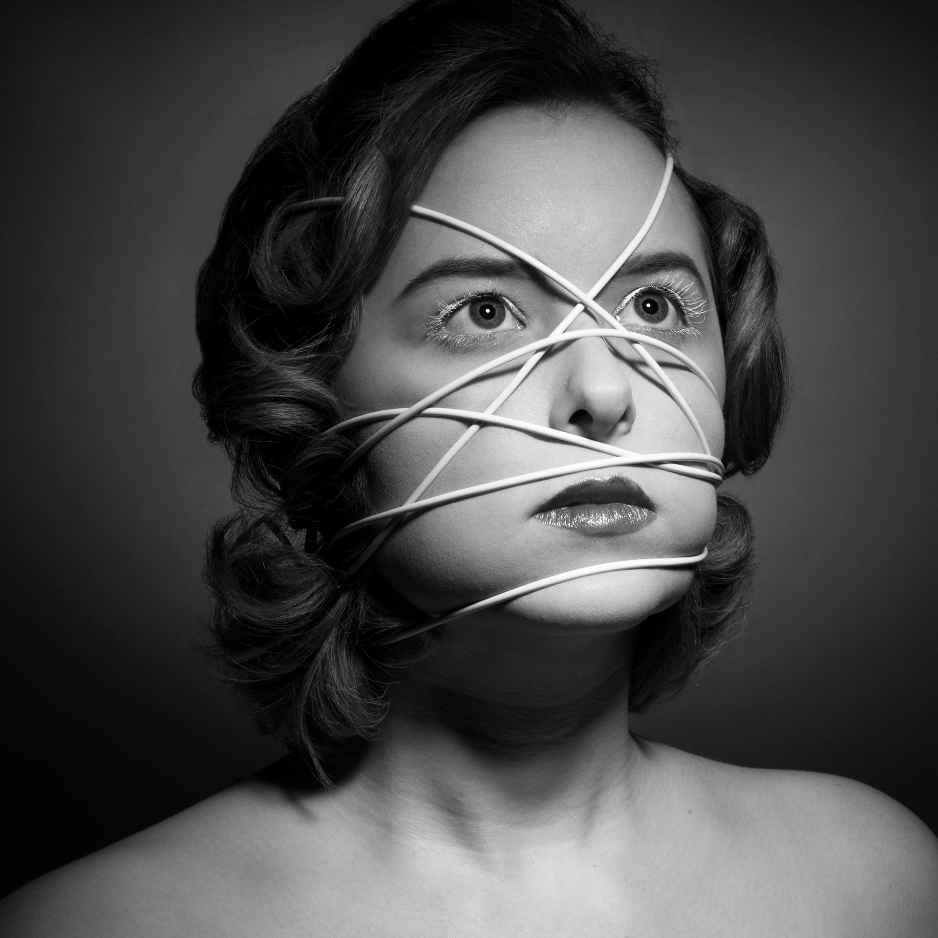 female model artistic impression wrapped in wire, unique makeup