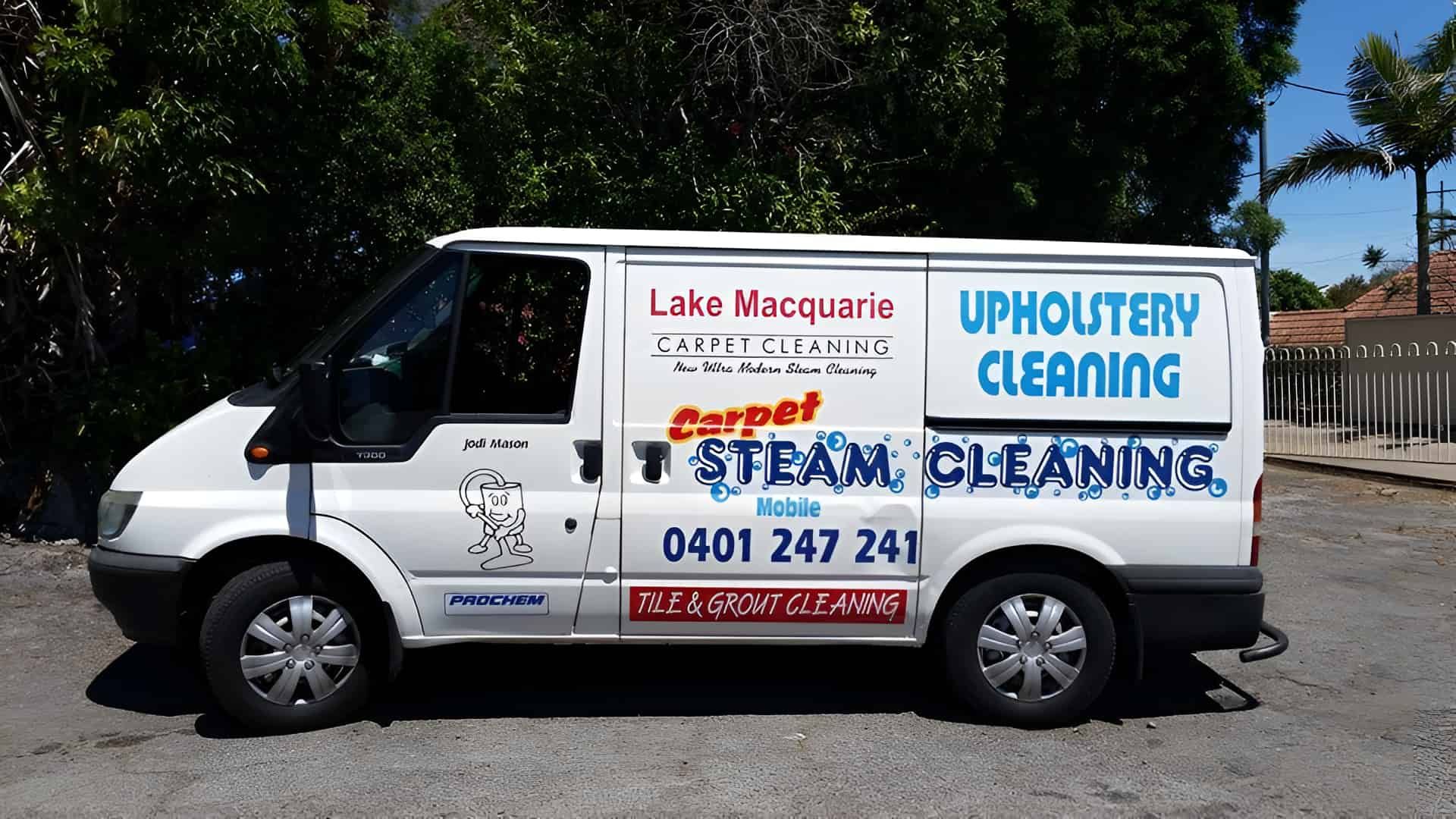 A White Van For Upholstery Cleaning Is Parked In A Parking Lot — Lake Macquarie Carpet Cleaning In Warners Bay, NSW