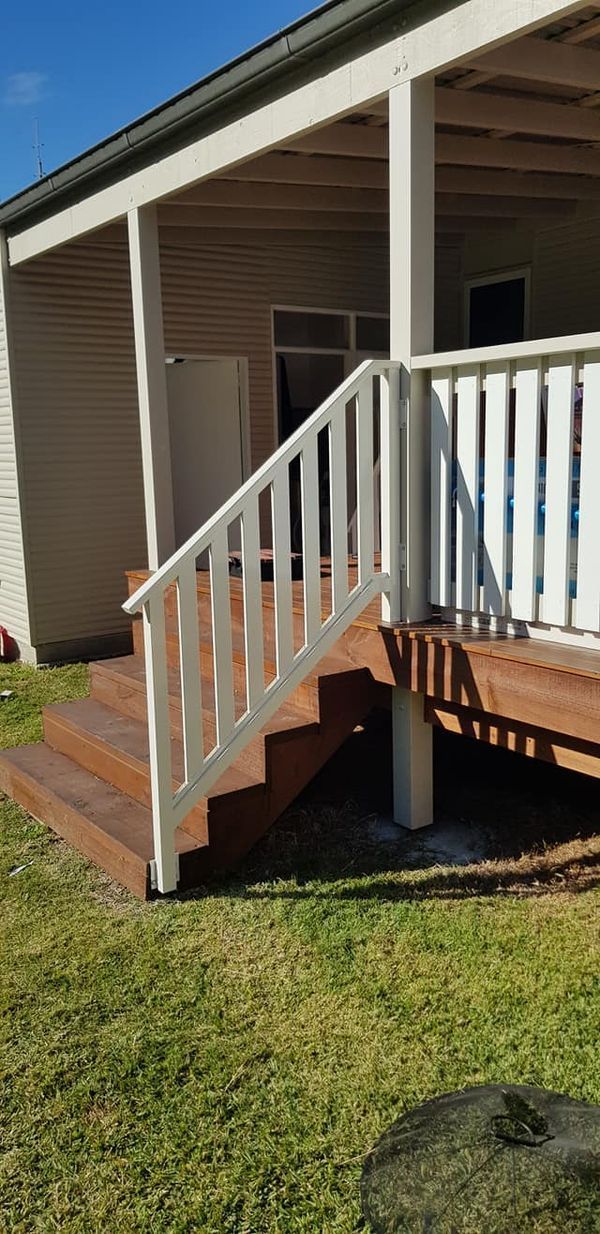 A Close up Of a Wooden Staircase with A White Wall in The Background — FBM Fabrication In Dapto, NSW