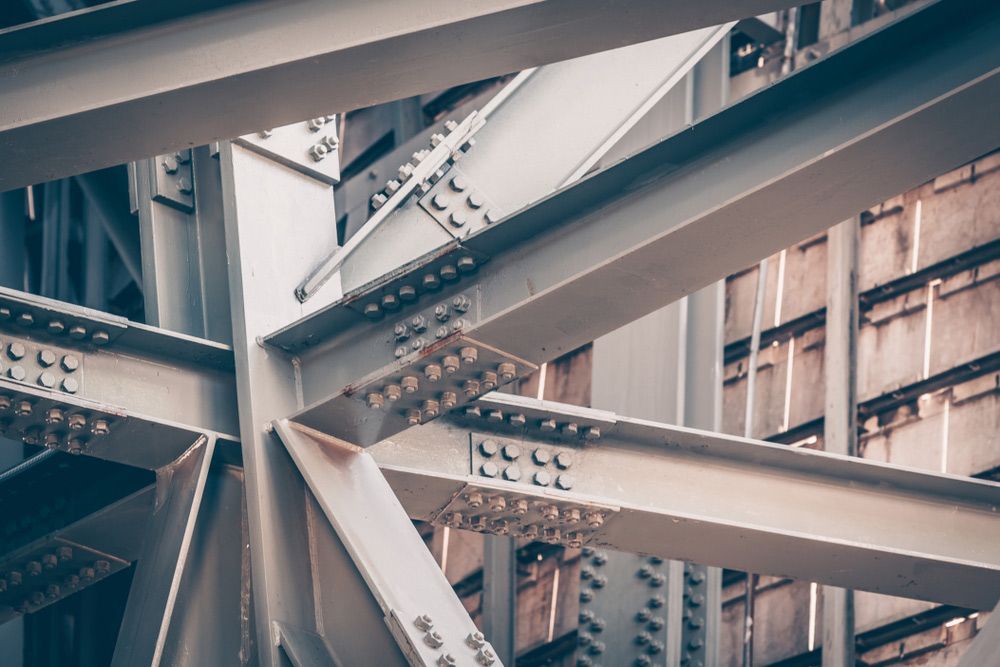 A Close up Of a Metal Structure with A Building in The Background — FBM Fabrication In Dapto, NSW