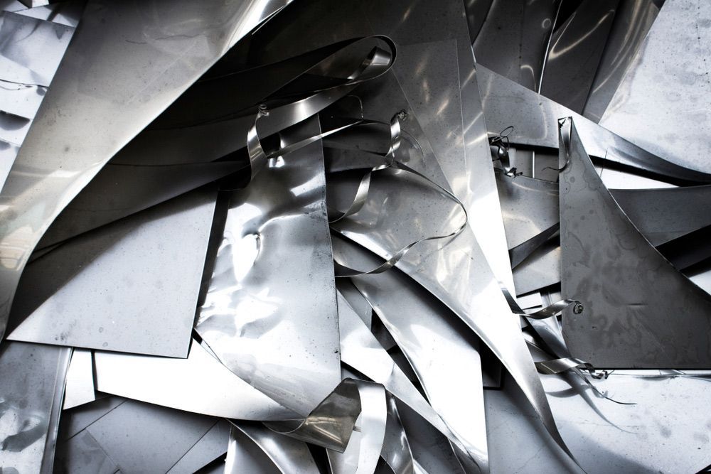 A Pile of Aluminum Foil Is Laying on A Table — FBM Fabrication In Nowra, NSW